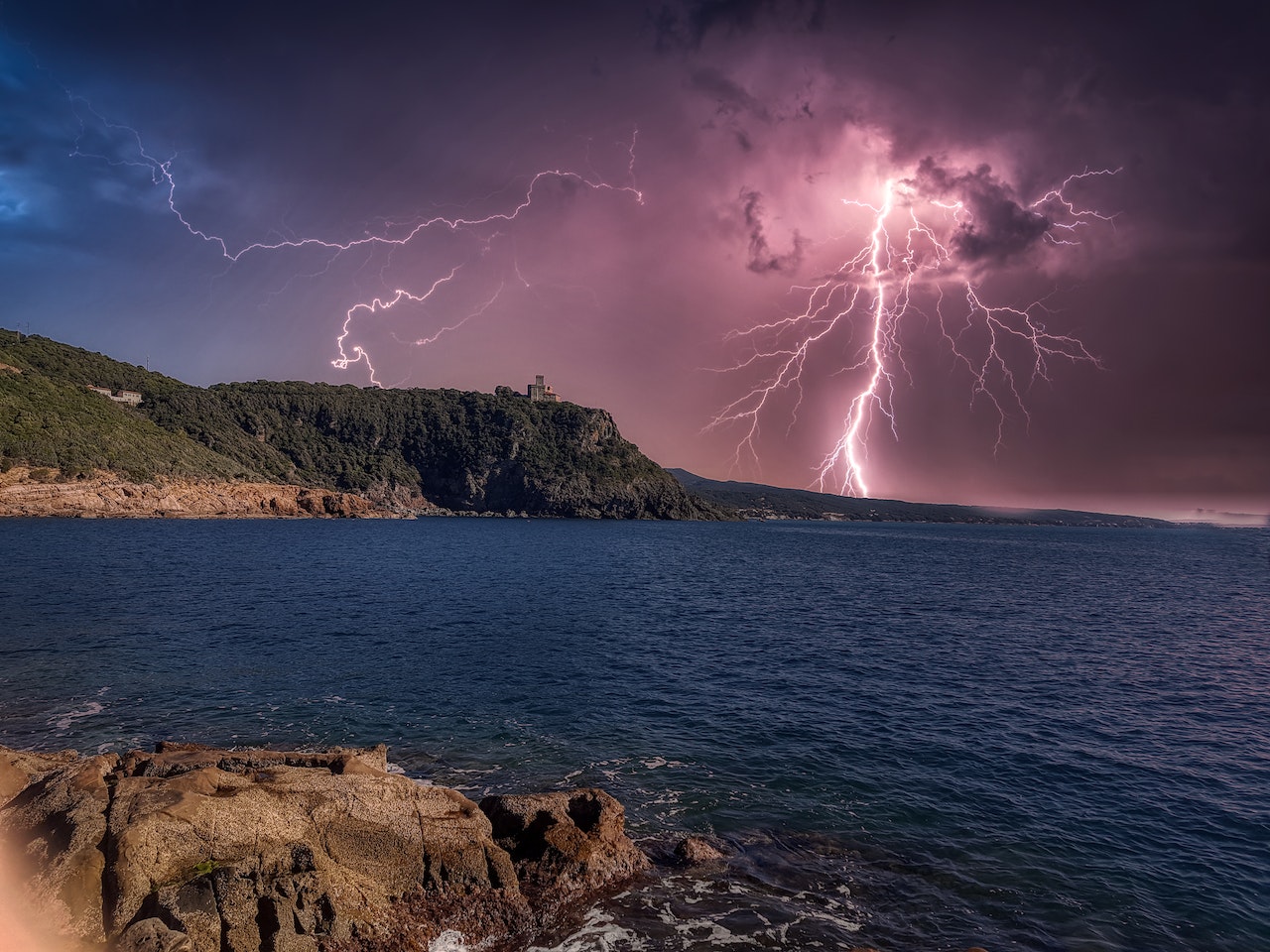 How to Handle Your Exotic Pet During Extreme Weather [Vital Tips], a thunderstorm near a beach